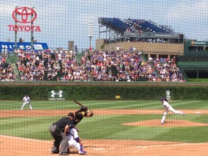 A Cubs pitcher throws to All-Star Andrew McCutchen. These days, Cubs fans only see player's of McCutchen's ability when a decent visiting team comes to town. And yet, Cubs fans always show up for their hometown team — even after more than a century of losing. But why? (Photo taken by Taylor Pangman)